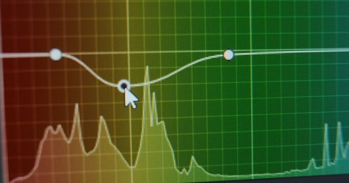 Film editor makes color grading of footage using curves instrument with histogram in computer program macro view