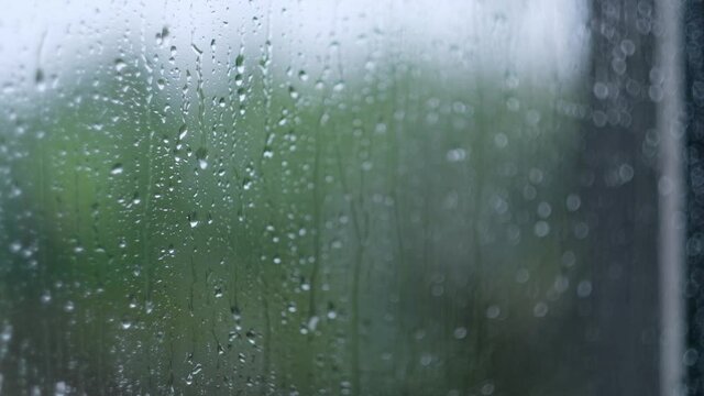 Raining outside the mirror of window in 4k