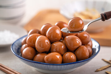 Taiwanese food - Homemade delicious stewed braised quail eggs in a plate for eating.