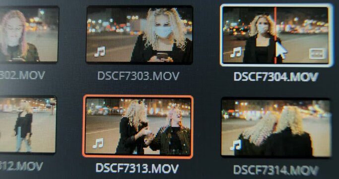 Film maker previews videos choosing footages for new project in contemporary computer program macro view
