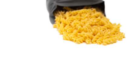 pasta close-up on a white background. Pasta spilled out of the package.
