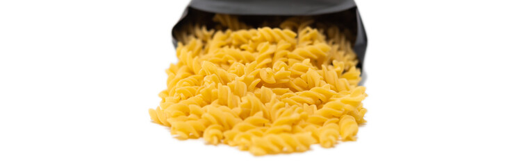 pasta close-up on a white background. Pasta spilled out of the package.