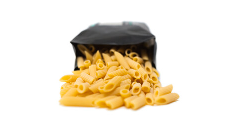 pasta close-up on a white background. Pasta spilled out of the package.