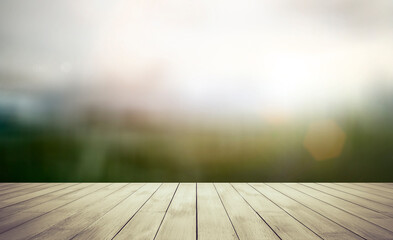 Wooden table top with blurred a field and sky background, use for display products.