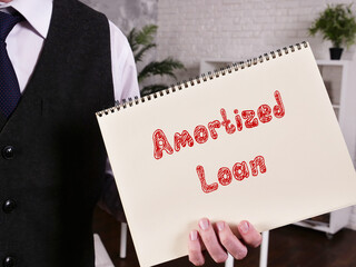 Business concept about Amortized Loan with sign on the piece of paper.
