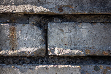 texture of an old wall made of concrete and large bricks. background