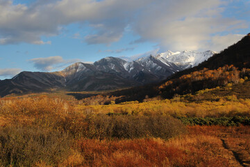Fototapeta premium Trekking around volcanoes of Kamchatka in fall season