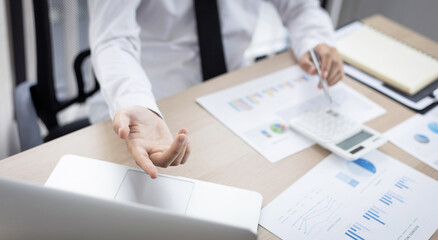 Finance workers are analyzing data in a private office.
