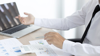 Finance workers are analyzing data in a private office.