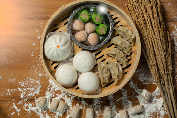Chinese traditional food. Traditional chinese steamed dumplings Dim Sums in bamboo steamer. Flat lay composition Asian food background.