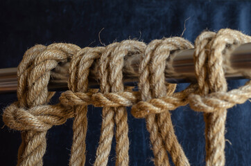 Metal pipe with repeating knots.