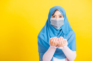 Asian Muslim Arab, Portrait beautiful young woman religious wear veil hijab and face mask protect...