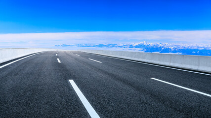 Fototapeta premium Asphalt road and mountain with sky clouds landscape.