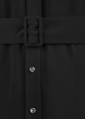 Part of black dress with buttons close up