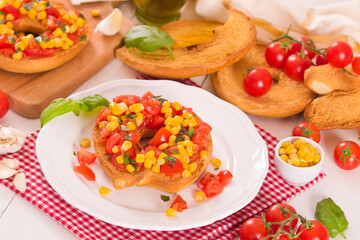 Friselle with tomatoes and mais.