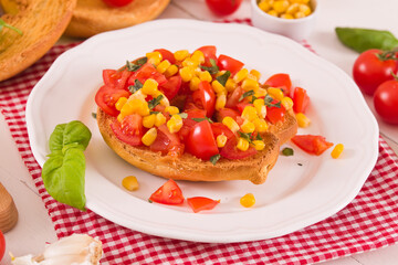 Friselle with tomatoes and mais.