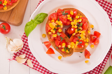 Friselle with tomatoes and mais.