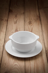 Empty soup cup or salad bowl on a wooden table