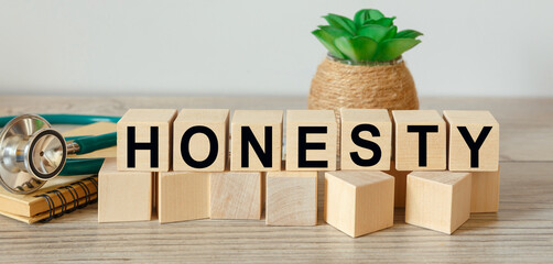 Wooden cubes with the abbreviation HONESTY
