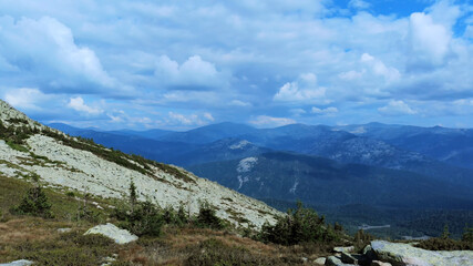 Fototapeta na wymiar Landscape of scenic mountain forest background and peak of blue rock range.
