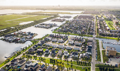 Modern suburban area Noorderplassen in Almere, The Netherlands, featuring artificial islands,...