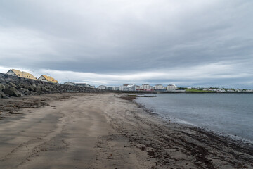 View sea on beach at Reykjavik at cloudy day.