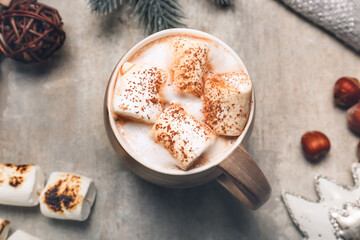 Cup of tasty cocoa drink with marshmallows on table