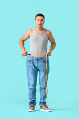 Man with sudden weight loss problem on color background. Diabetes symptoms
