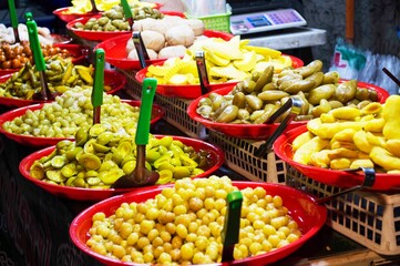Many Thai pickled fruits in the night market