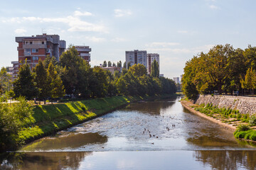 Fototapeta premium View of the river Miliatska and residential buildings in Sarajevo. Bosnia and Herzegovina