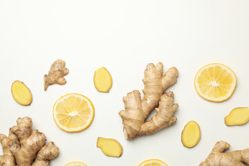 Fototapeta na wymiar Fresh ginger and lemon on white background, top view