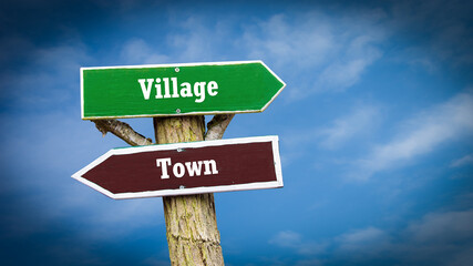 Street Sign to Village versus Town