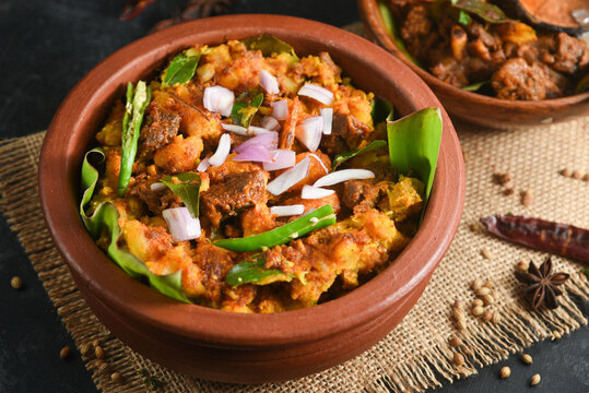 Kappa Puzhukku kappa biryani Cooked tapioca , Cassava root , Mandioca , Aipim with spicy fish meat beef pork curry, Kerala India. Prepared South Indian food, served with chutney. root vegetable Brazil