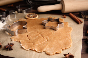 Making homemade Christmas cookies. Dough and cutters on table, closeup