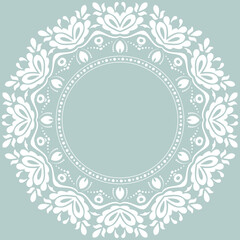 Oriental vector pattern with arabesques and floral elements. Traditional classic light blue and white round ornament. Vintage pattern with arabesques