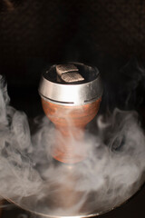 hookah bowl with coals in the smoke