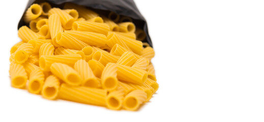 pasta close-up on a white background. Pasta spilled out of the package.