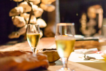 Glass of white wine on rustic bar counter