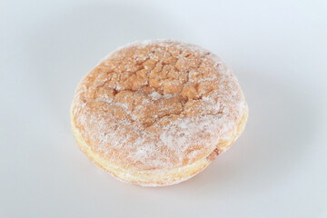 donut filled with blueberry jam on white background
