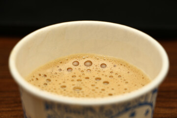 Tea with foam in a Paper cup