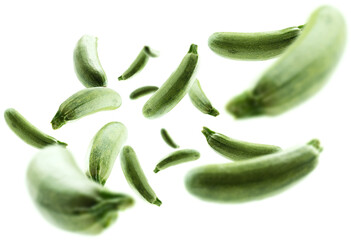 Green zucchini levitate on a white background