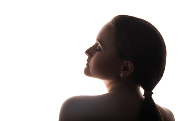 Woman silhouette. Mindfulness tranquility. Profile portrait of peaceful brunette lady with bare shoulders closed eyes isolated on white copy space background. Beauty wellness. Subconscious energy.