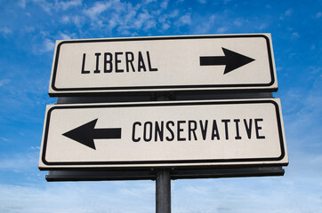 Liberal vs conservative. White two street signs with arrow on metal pole with word. Directional...