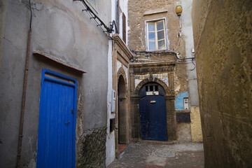 Historic fishing city Essaouira with narrow streets, blue coloured doors of houses