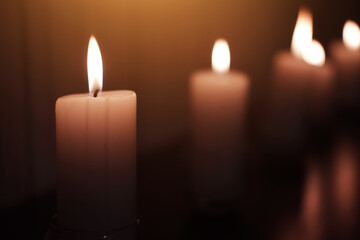 Candle light in Glass cup decoration in spa and christmas night party in Bokeh background. Holiday and Romantic love on valentines day Concept. Prayer and peace in Buddhism