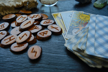 wooden runes from the Tarot card on the table