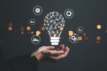Business woman holding light bulbs, ideas of new ideas with innovative technology and creativity