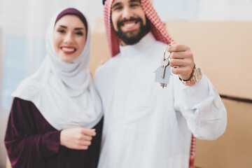 Man and woman stand in a new apartment.