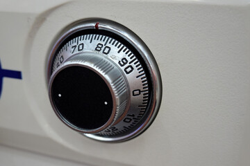 Close-up of a combination dial on a safe. combination lock on the safe closeup white     