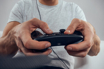 Gamepad male hands close-up video game addiction office technology